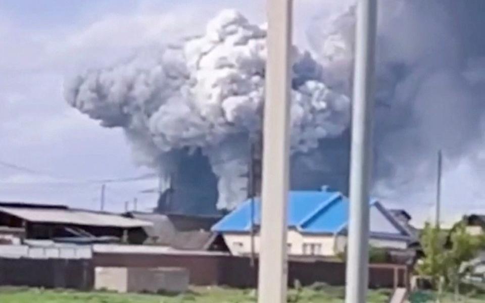 Smoke rises following a drone attack on a military unit in the Sredny settlement