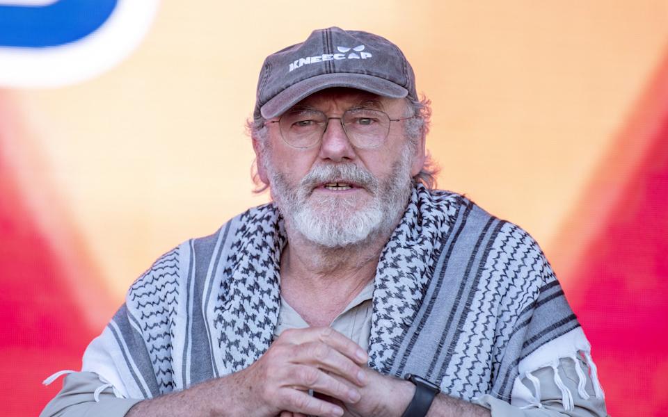 Liam Cunningham, seen here in Italy in a keffiyeh and Kneecap hat, is reportedly among the group of activists sailing to Gaza
