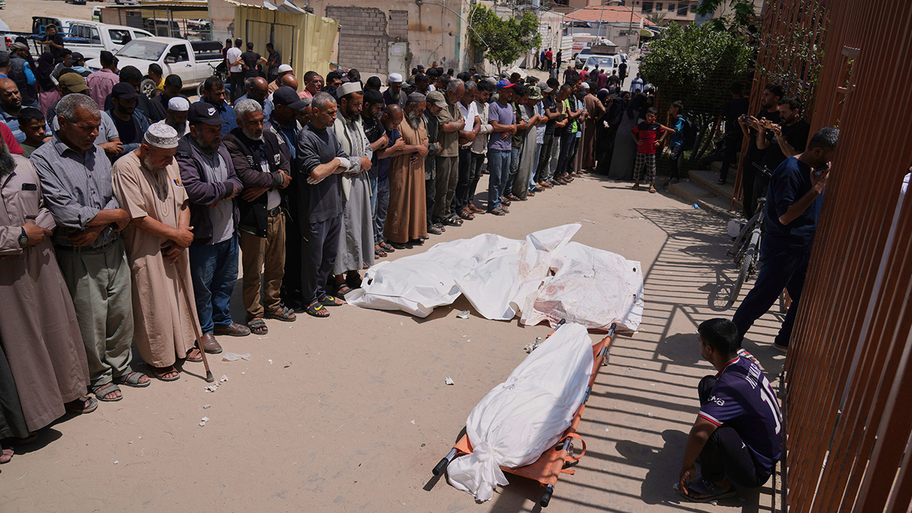 Palestinians pray during the funeral of a person who was killed while heading to a Gaza aid hub, along with three others who were killed during an Israeli strike, June 1, 2025.