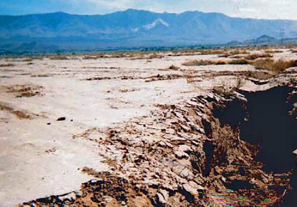 Loren Metzger at the USGS took this photo of one of the fissures that opened up after the withdrawal of groundwater near what was Lucerne Lake in San Bernardino County/Mojave Desert. Some fissures are more than 3.3 feet wide and deep. "Fissuring often is associated with localized differential compaction of sediments," the USGS reported.
