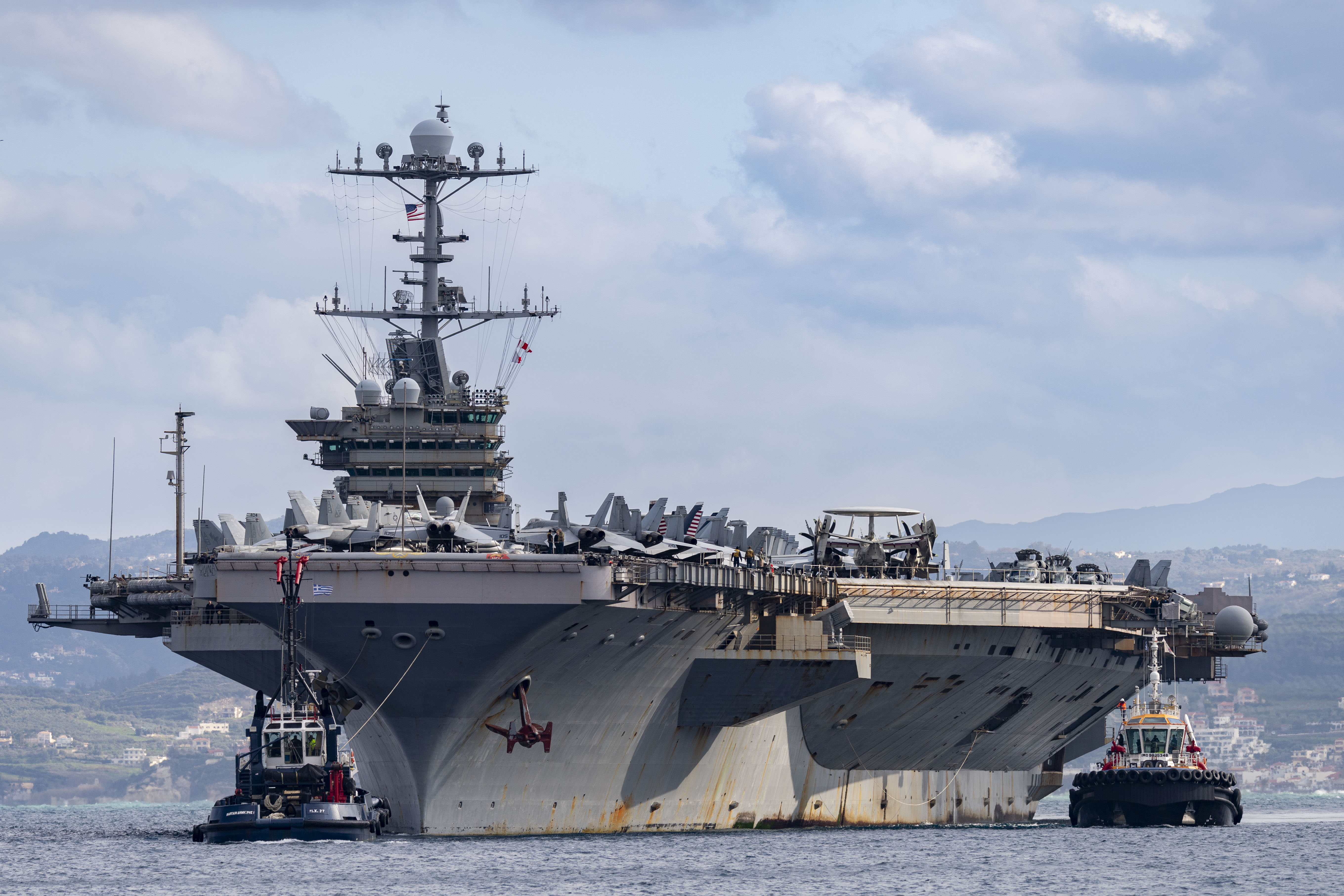 NAVAL SUPPORT ACTIVITY SOUDA BAY, Greece (Feb. 6, 2025) The Nimitz-class aircraft carrier USS Harry S. Truman (CVN 75) arrives at the NATO Marathi Pier Complex in Souda Bay, Crete, Greece, during a scheduled port visit on Feb. 6, 2025. NSA Souda Bay provides logistical and operational support to the components of the Harry S. Truman Carrier Strike Group, which arrived in the Eastern Mediterranean after two months of combat operations in the U.S. Central Command area of responsibility. NSA Souda Bay is an operational ashore installation that enables and supports U.S., Allied, Coalition, and partner nation forces to preserve security and stability in the European, African, and Central Command areas of responsibility. (U.S. Navy photo by Mass Communication Specialist 2nd Class Andrew Eder)