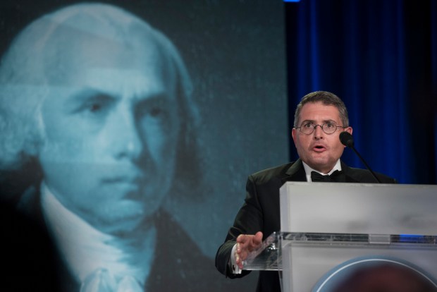 Leonard Leo speaks at a lectern.