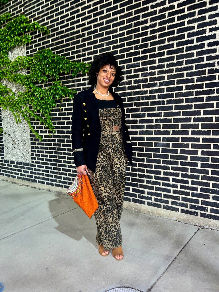 cydney patrice cleveland portrait in front of brick wall full body shot so her boots are visible