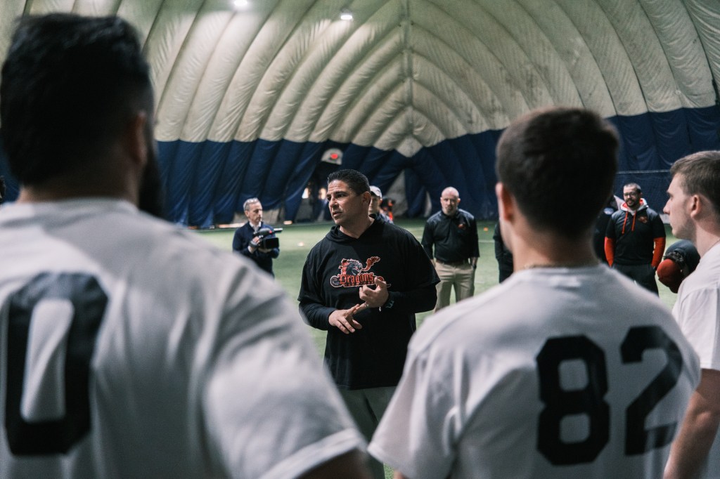 Dragons coach Gerald Filardi talks to players during tryouts on April 8.