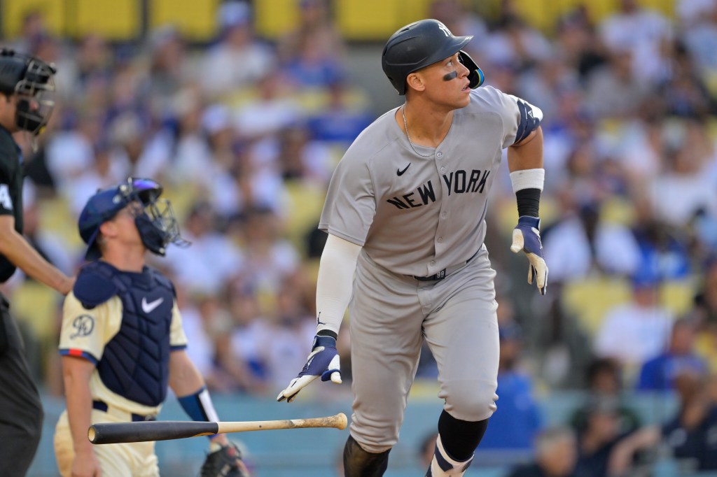 Aaron Judge of the New York Yankees watches his home run.