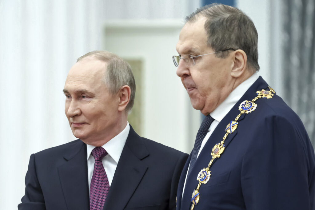 Russian President Vladimir Putin, left, awards Russian Foreign Minister Sergey Lavrov with the Order of St. Andrew the Apostle the First-Called during a ceremony to present highest state awards in the Catherine Hall of the Kremlin's Senate Palace in Moscow, Russia, Thursday, May 22, 2025.