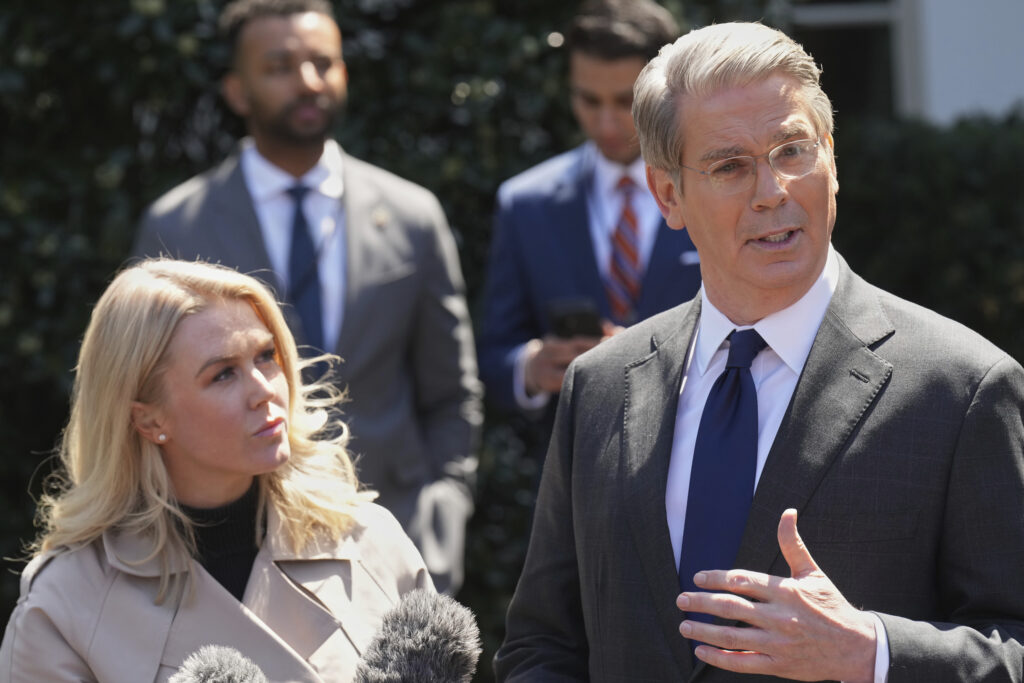 Treasury Secretary Scott Bessent speaks to reporters outside the West Wing of the White House, Wednesday, April 9, 2025, in Washington, with White House press secretary Karoline Leavitt. (AP Photo/Jacquelyn Martin)